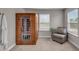 Relaxing sauna room with a wood sauna, chair, and natural light from the window at 1105 Alaska St, Hampton, GA 30228