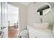 Stylish powder room featuring a vessel sink, modern fixtures, and sleek white cabinetry at 1276 Dahlgren Se Ln, Atlanta, GA 30316