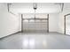 Clean and organized garage with epoxy flooring, ample space, and a modern garage door at 1276 Dahlgren Se Ln, Atlanta, GA 30316