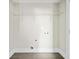 Functional laundry room with tiled floor and wire shelving for efficient storage at 1276 Dahlgren Se Ln, Atlanta, GA 30316