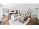 Open-concept living area with a comfortable sofa, modern decor, and an eat-in kitchen at 1276 Dahlgren Se Ln, Atlanta, GA 30316