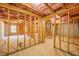 Unfinished basement with wooden framing, insulation, and concrete floor at 132 Windmeadow Way, Fayetteville, GA 30214