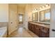 Bathroom features double vanity with granite countertops and tile flooring at 132 Windmeadow Way, Fayetteville, GA 30214