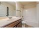 Traditional bathroom with a wooden vanity, white countertops, and a shower-tub combination at 132 Windmeadow Way, Fayetteville, GA 30214