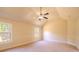 Bedroom with high ceilings, ceiling fan, neutral paint and carpet, and windows at 132 Windmeadow Way, Fayetteville, GA 30214