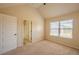 Bedroom with large window, closet, and ensuite bathroom at 132 Windmeadow Way, Fayetteville, GA 30214