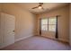 Neutral bedroom with carpet, a ceiling fan, and natural light from a window with curtains at 132 Windmeadow Way, Fayetteville, GA 30214