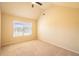 Bright bedroom featuring carpet, a ceiling fan, and natural light from a window with blinds at 132 Windmeadow Way, Fayetteville, GA 30214