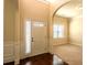 Inviting foyer with sidelight windows, white trim and wood flooring, creating an airy entrance at 132 Windmeadow Way, Fayetteville, GA 30214