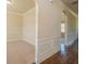 Hallway connecting rooms with classic archways and wood floors, enhancing the flow and charm at 132 Windmeadow Way, Fayetteville, GA 30214