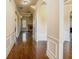 Bright hallway with wood floors, arched doorways, and white molding offers a welcoming transition between rooms at 132 Windmeadow Way, Fayetteville, GA 30214
