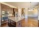 Spacious kitchen with a granite island, stainless steel appliances, and hardwood flooring at 132 Windmeadow Way, Fayetteville, GA 30214