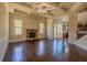 Spacious living room with fireplace, coffered ceiling, and gleaming hardwood floors at 132 Windmeadow Way, Fayetteville, GA 30214