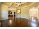 Open living space featuring hardwood floors, coffered ceilings, fireplace and access to other rooms at 132 Windmeadow Way, Fayetteville, GA 30214