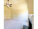 Bright living room with a neutral color palette, high ceilings, and a ceiling fan at 132 Windmeadow Way, Fayetteville, GA 30214
