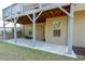 Covered patio beneath a deck, with a view of the lawn at 132 Windmeadow Way, Fayetteville, GA 30214