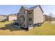 Exterior shot of the home's rear showcasing the deck and backyard at 132 Windmeadow Way, Fayetteville, GA 30214