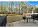 The backyard has a patio with table and chairs, a partially-fenced yard, and a shed at 2155 Westwind Dr, Roswell, GA 30075