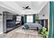 The bedroom features modern decor, including a tray ceiling, a fan, and ample closet space, perfect for organization at 2155 Westwind Dr, Roswell, GA 30075