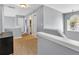 The second floor hallway is spacious and airy with lots of natural light and neutral paint at 2155 Westwind Dr, Roswell, GA 30075