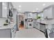 Stylish kitchen featuring granite countertops, stainless steel appliances, and modern cabinetry at 2155 Westwind Dr, Roswell, GA 30075