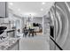Open kitchen with stainless steel appliances and seamless flow to a breakfast area and living space at 2155 Westwind Dr, Roswell, GA 30075