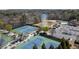 Aerial view showcasing community tennis courts, a pool, lake access and playground at 3053 Cambridge Hill Dr, Dacula, GA 30019