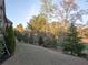 Lush, well-manicured backyard with mature trees, shrubs and manicured lawn at 3053 Cambridge Hill Dr, Dacula, GA 30019