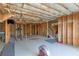 Unfinished basement with exposed wooden framing and insulation, offering versatile expansion possibilities at 3053 Cambridge Hill Dr, Dacula, GA 30019