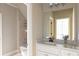 Bathroom featuring granite countertops, a soaking tub with shower, and neutral toned tile at 3053 Cambridge Hill Dr, Dacula, GA 30019