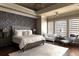 Stylish primary bedroom features a tray ceiling, accent wall, and adjoining Bedroom at 3053 Cambridge Hill Dr, Dacula, GA 30019