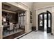 Open-concept dining room featuring hardwood floors and views of the front entryway at 3053 Cambridge Hill Dr, Dacula, GA 30019