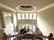 Grand foyer with ornate trim, curved staircase, and a view of the living room and piano at 3053 Cambridge Hill Dr, Dacula, GA 30019