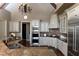 Bright kitchen with stainless steel appliances, granite countertops, and custom cabinetry at 3053 Cambridge Hill Dr, Dacula, GA 30019