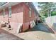 Backyard featuring a brick building, concrete patio and fence at 3221 Colquitt Dr, Atlanta, GA 30340