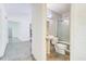 Bathroom featuring a tiled shower, a vanity sink, and a toilet at 3221 Colquitt Dr, Atlanta, GA 30340