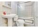 Bathroom featuring a pedestal sink, toilet and glass enclosed shower at 3221 Colquitt Dr, Atlanta, GA 30340