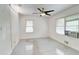 Bedroom featuring windows, a ceiling fan, and tile floors at 3221 Colquitt Dr, Atlanta, GA 30340