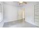 Bedroom with neutral floors and walls, featuring a ceiling fan at 3221 Colquitt Dr, Atlanta, GA 30340