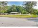 A cozy single-story home with a white picket fence, situated on a corner lot surrounded by mature trees at 3221 Colquitt Dr, Atlanta, GA 30340