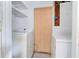 Laundry room with washer, dryer, and open shelving at 3221 Colquitt Dr, Atlanta, GA 30340