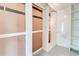 Walk-in storage closet with built in shelving and door at 3221 Colquitt Dr, Atlanta, GA 30340