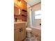 Well-lit bathroom with stylish fixtures and tiled shower at 5085 Lake Dr, Forest Park, GA 30297