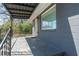 Inviting covered front porch with metal railing and ample space at 5085 Lake Dr, Forest Park, GA 30297
