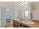 Bathroom featuring dual sinks, granite countertops, and a shower/tub combination at 1246 Foxcreek Dr, Mcdonough, GA 30252