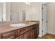 Bathroom featuring dual sinks with granite countertops and tile flooring at 1246 Foxcreek Dr, Mcdonough, GA 30252
