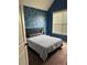 Bedroom with a unique accent wall and a large window for natural light at 1246 Foxcreek Dr, Mcdonough, GA 30252