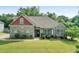 Charming single-story home with brick and siding exterior, manicured lawn, and inviting front entrance at 1246 Foxcreek Dr, Mcdonough, GA 30252