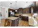 This kitchen has an island with granite countertops, stainless appliances, and lots of cabinet space at 1246 Foxcreek Dr, Mcdonough, GA 30252