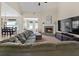 Open living room featuring a fireplace, plush seating, a TV, and lots of natural light at 1246 Foxcreek Dr, Mcdonough, GA 30252